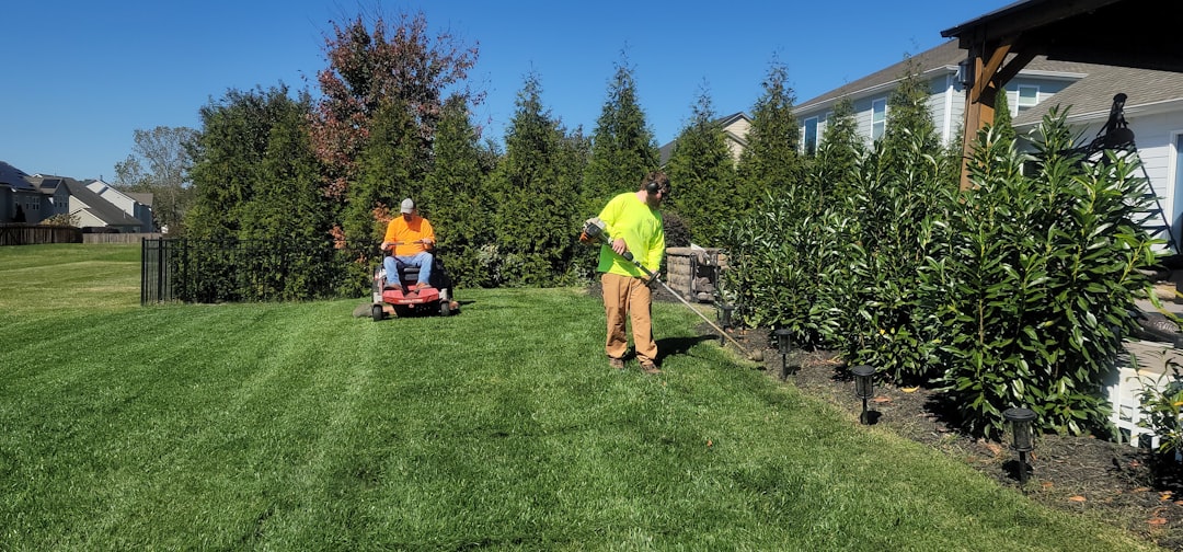 McNairy Lawn Care crew with mowing equipment on a residential McNairy County property